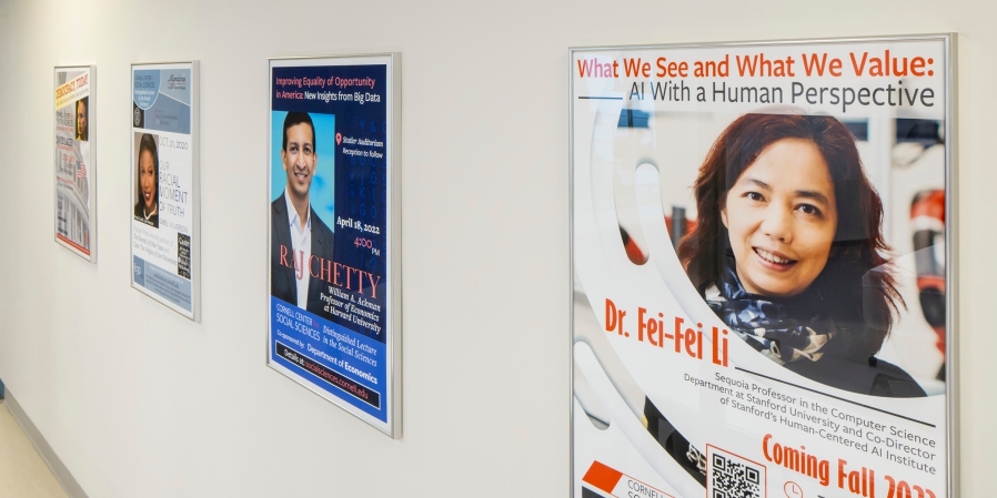 Image of hallway in Clark Hall displaying previous annual lecture posters.