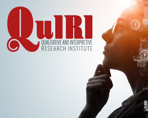 Woman researcher gazing up towards QuIRI logo
