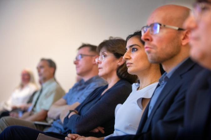 Faculty attending a lecture 