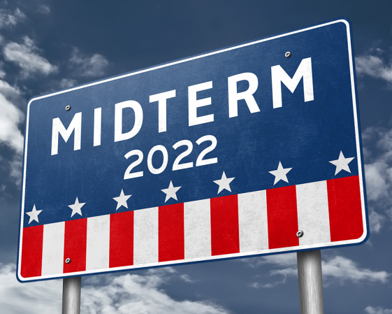 Photo of a road sign displaying the words "Midterm 2022"